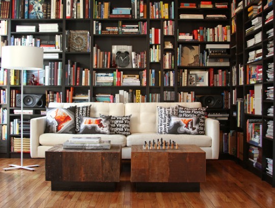 Contemporary home library with irregular bookshelves