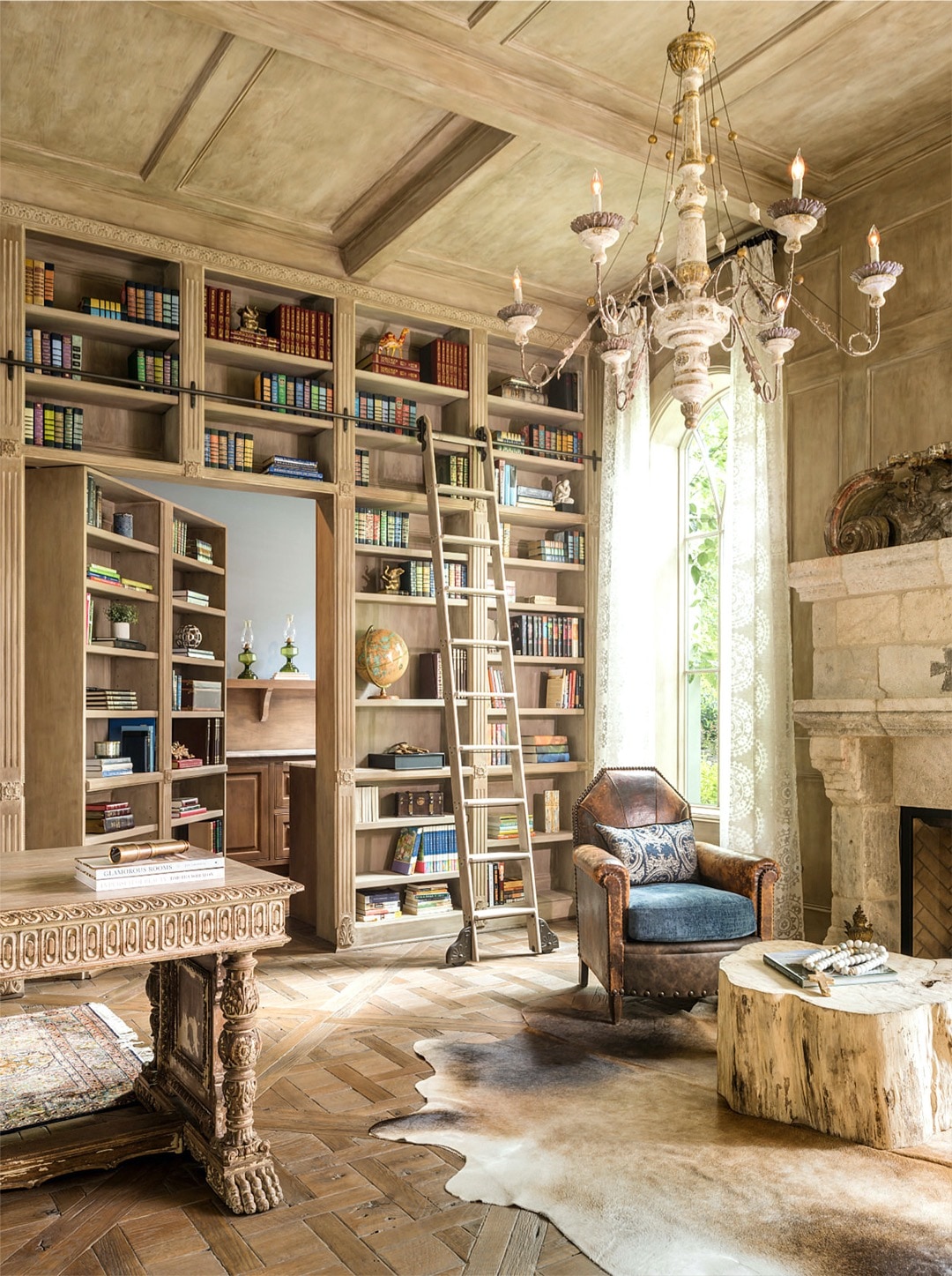 Mediterranean-style home library with hidden doors - home library ideas