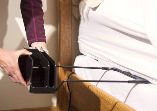 The Night Caddy bedside organizer and charger in one